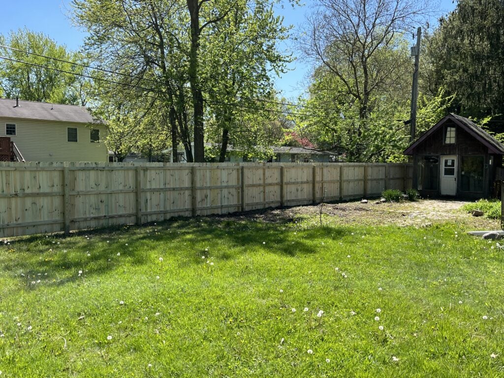 A finished backyard fence project